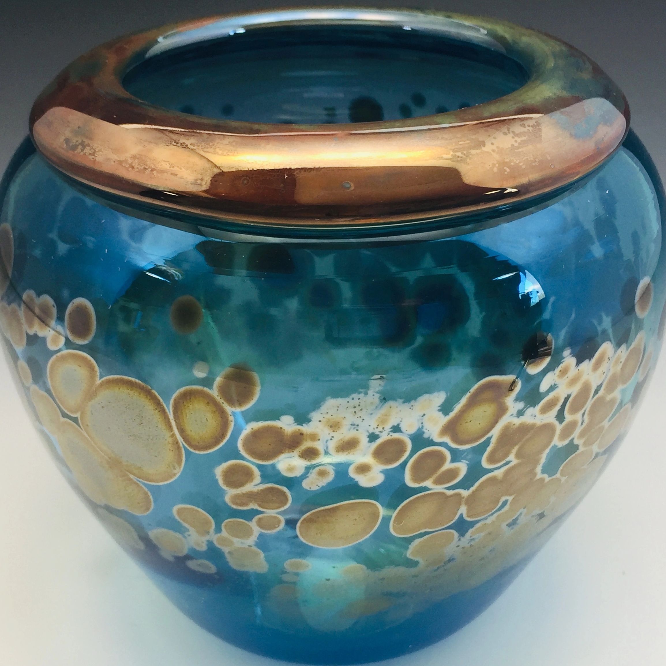 Teal blue glass vessel with copper rim by Alex Kalish